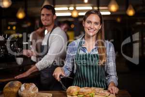 Pretty barista smiling at camera