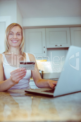 Pretty blonde woman ordering online