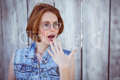 shocked hipster woman looking away from the camera