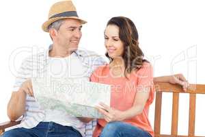 Couple on bench looking at map