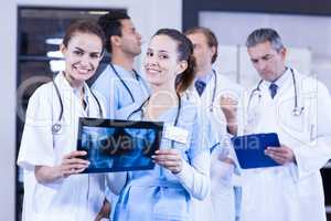 Female doctors checking x ray reports