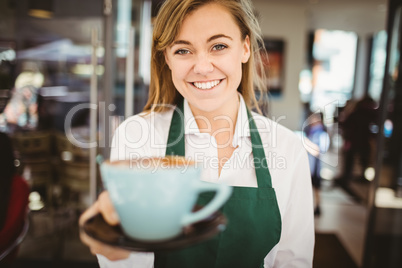 Waitress serving a cup of coffee