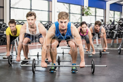 Athletic men and women working out