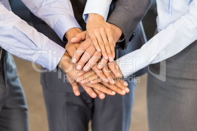 Close-up of businesspeople stacking hands