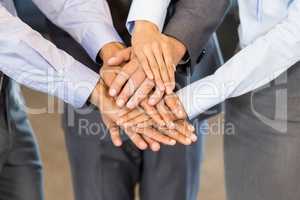 Close-up of businesspeople stacking hands
