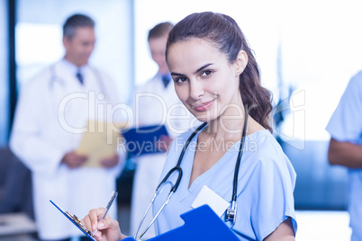 Female doctor writing a medical report