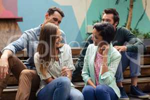Happy friends talking