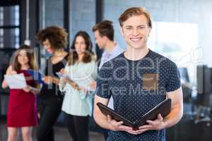 Portrait of smiling man holding a document