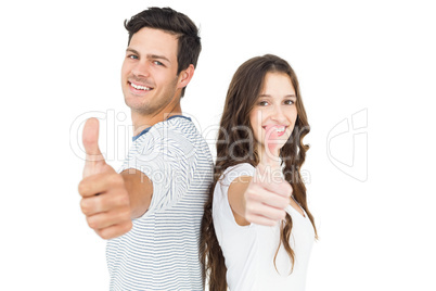 Couple standing back to back with thumbs up