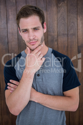 Handsome hipster with hand on chin