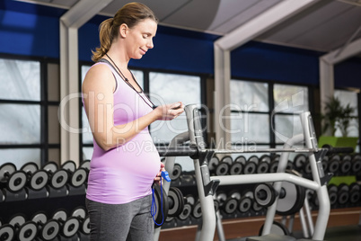 Pregnant woman looking at a stopwatch