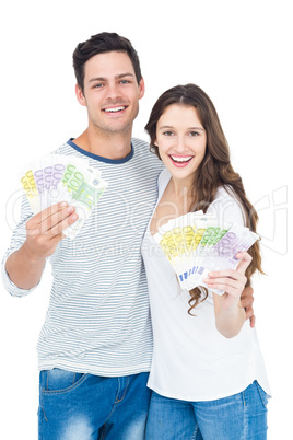 Happy couple holding money