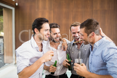 Group of young men having drinks