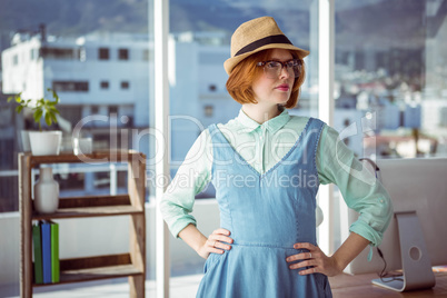 Pretty hipster wearing nerd glasses and hat