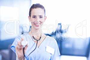 Female doctor holding a  stethoscope