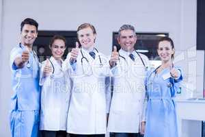 Medical team putting thumb up and smiling