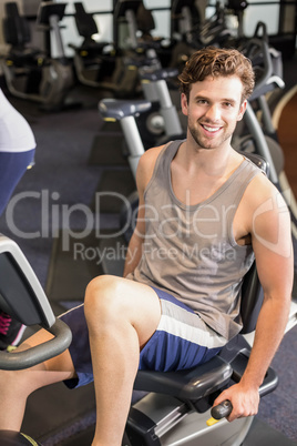 Fit man doing exercise bike