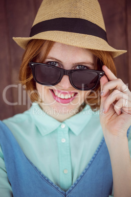 Cute red haired hipster with sunglasses