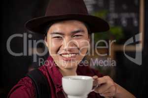 Happy customer drinking coffee