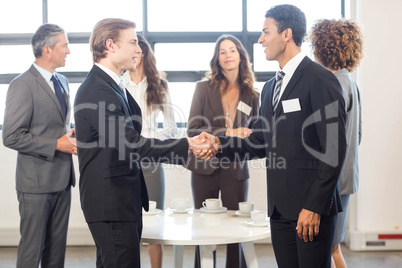 Businessman interacting with his team