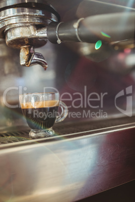 Close up of cup on a coffee machine