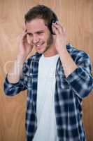 Handsome man listening to music with headphone