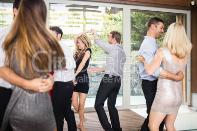 Group of young friends dancing