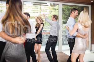 Group of young friends dancing