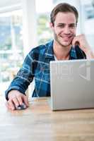 Handsome man working on laptop