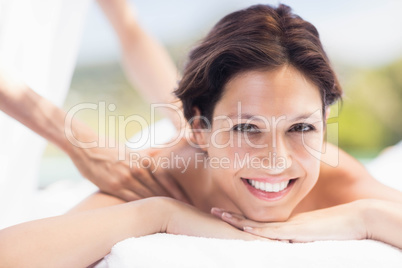 Woman receiving a back massage from masseur