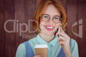 Hipster talking on phone having coffee