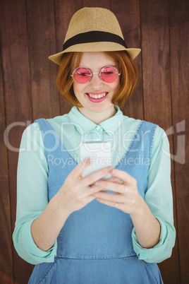 Cute red haired hipster texting