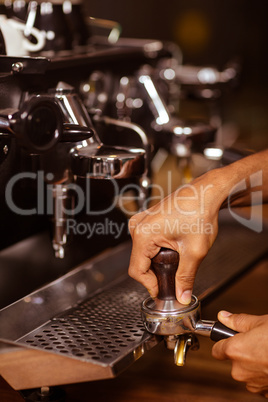 Close-up of a barista preparing coffee