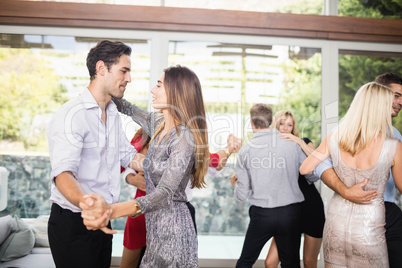 Group of young friends dancing