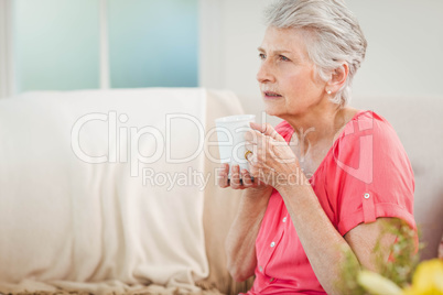 Senior woman drinking a cup of coffee