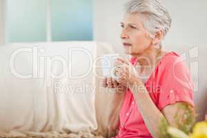 Senior woman drinking a cup of coffee