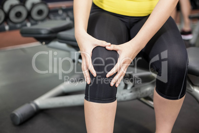 Fit woman having knees pain
