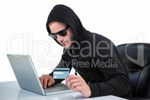 Man in black hoodie doing online shopping