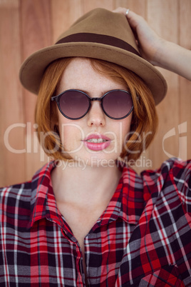 beautiful hipster woman in a hat and sunglasses