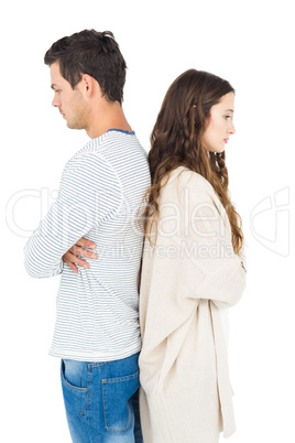 Couple standing back to back