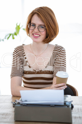 smiling hipster woman holding a coffeecup