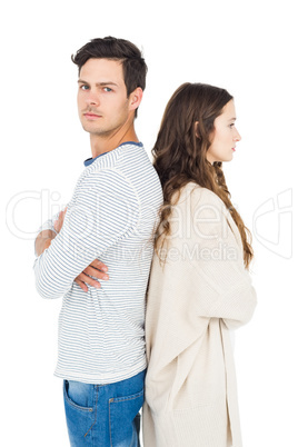 Couple standing back to back