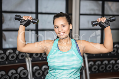 Woman exercising with dumbbells