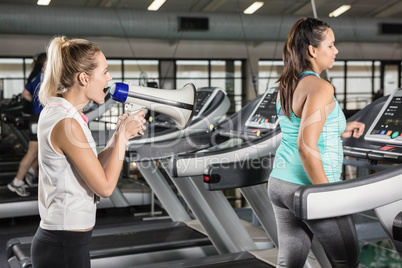 Trainer motivating woman