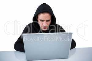 Handsome man in black hoodie using laptop