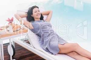 Young woman relaxing on a sun lounger