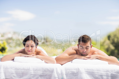 Young couple relaxing on massage table