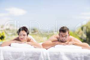 Young couple relaxing on massage table