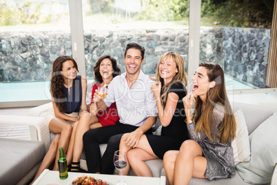 Happy man sitting with woman and having fun