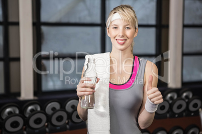 Smiling blonde showing thumb up